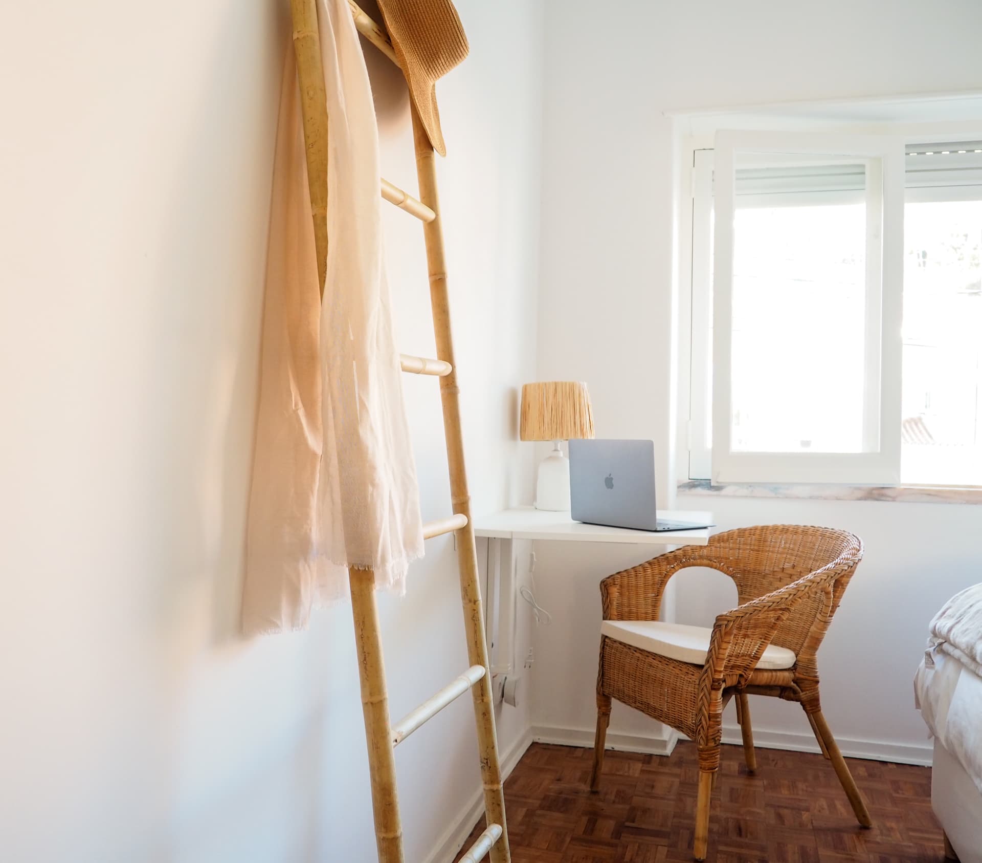 Bedroom in the attic apartment with a bed and natural light